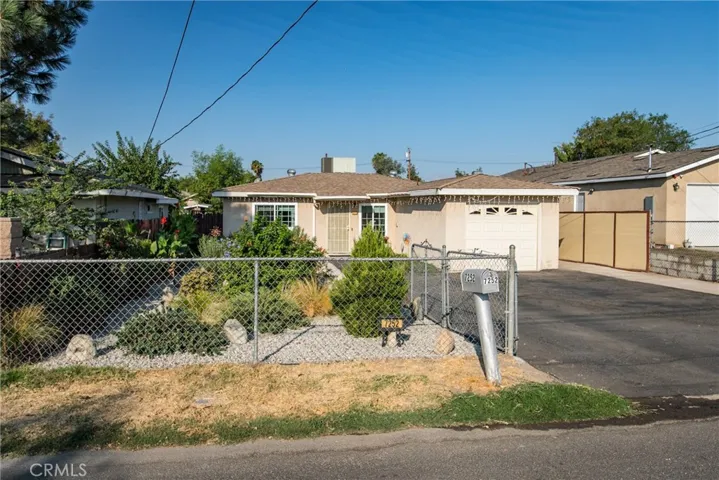 Fully fenced yard with gorgeous drought tolerant landscaping.