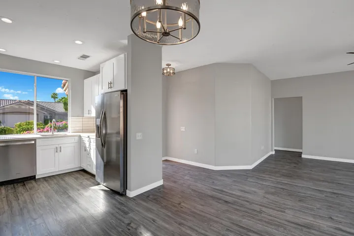 DINING ROOM OUT TO KITCHEN AND LIVING RO