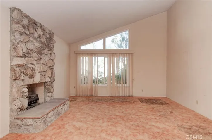 'Palos Verdes' Stone Fireplace  wiht Raised Hearth in Living Room.