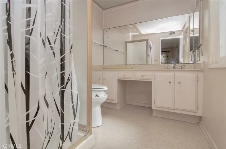 Owner's Bath with dressing table and extra long vanity.
