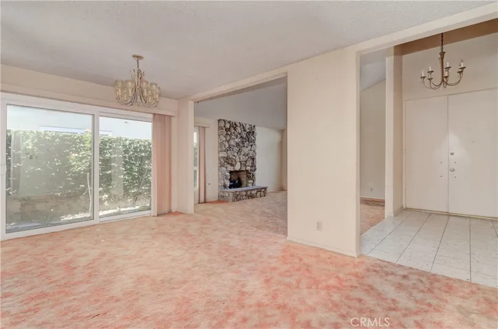 View from Formal Dining, with Sliders to "Atrium' area, to Double Door Entry.
