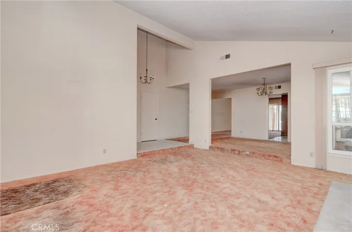 Huge Living Room with soaring vaulted ceiling.