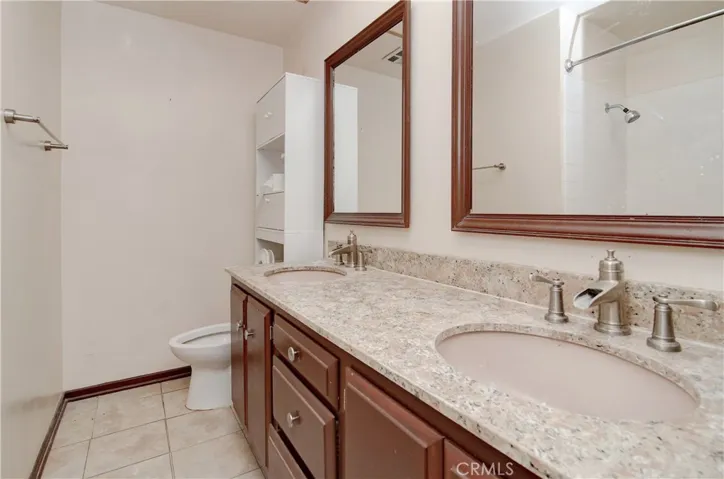 Hall Bath with  Dual Vanities and tiled tub/shower combo (out of view).