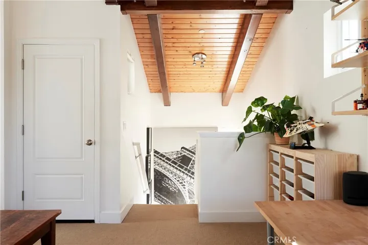 Stairs to the 3rd Floor Master bedroom suite, door to large deck.