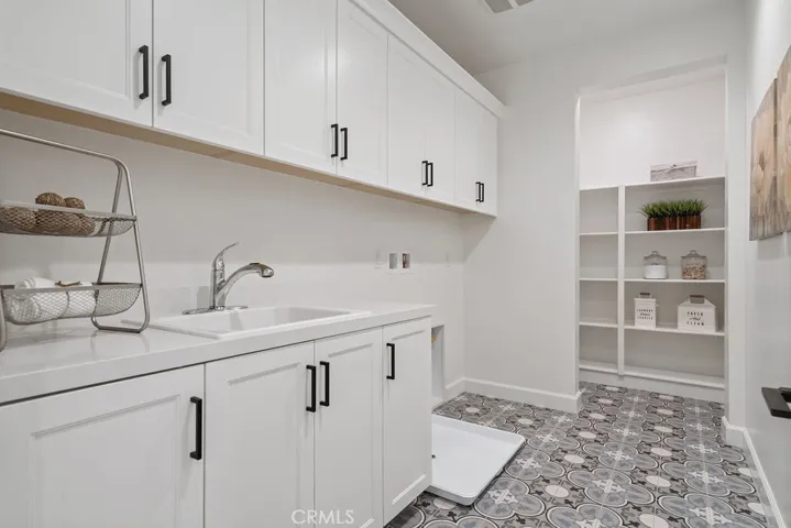 Laundry Suite with Farmhouse sink and walk in Storage pantry