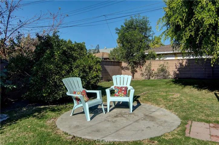 Large, grassy yard has it all...plenty of room for kids, pets, games or plenty of space for the gardener in you.