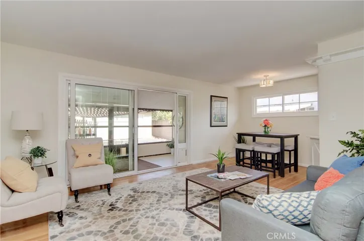 EZ living floor plan offers flexible living/dining space and beautiful, custom slider opens to covered porch and laundry area.