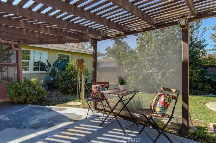 A nice, relaxing spot for dining or reading....or...just enjoying views of the private rear yard.