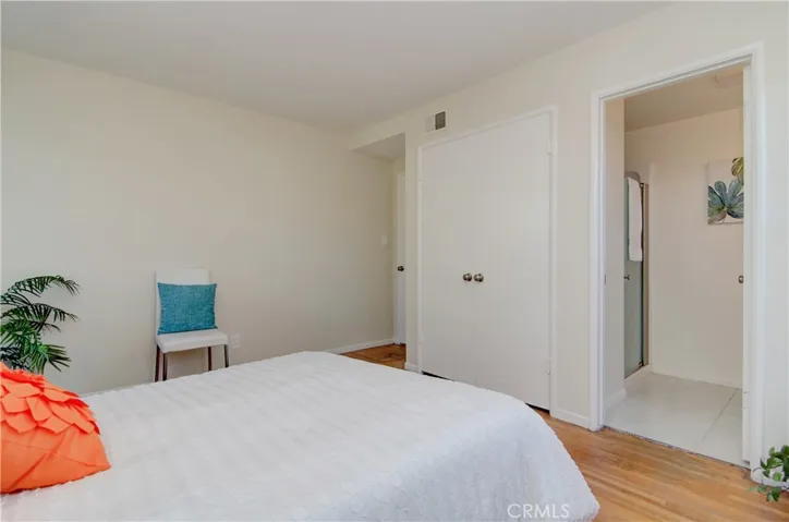 Private master bedroom has wardrobe closet and separate bath.