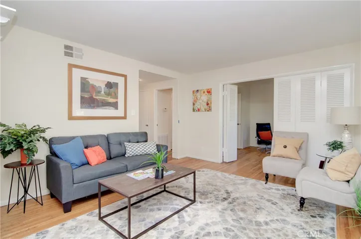 Fresh neutral paint throughout.  Beautiful louvered doors fold away to expand living space into den/bedroom #4.  This is a flexible floor plan!