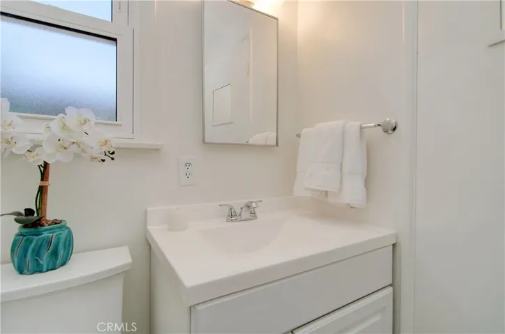 Remodeled master bath has upgraded fixtures and shower.