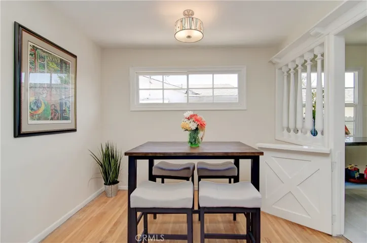 Love all the traditional woodwork and details in this flexible dining space!
