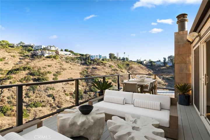 Spacious wraparound outdoor view decks unite the home with nature.