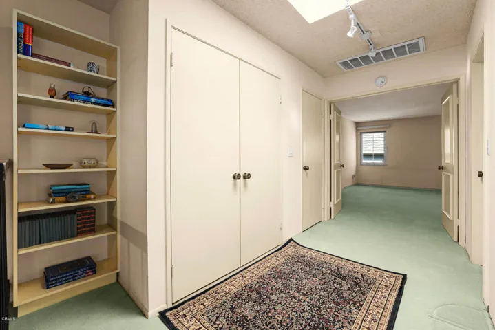 Upper hall way with skylight