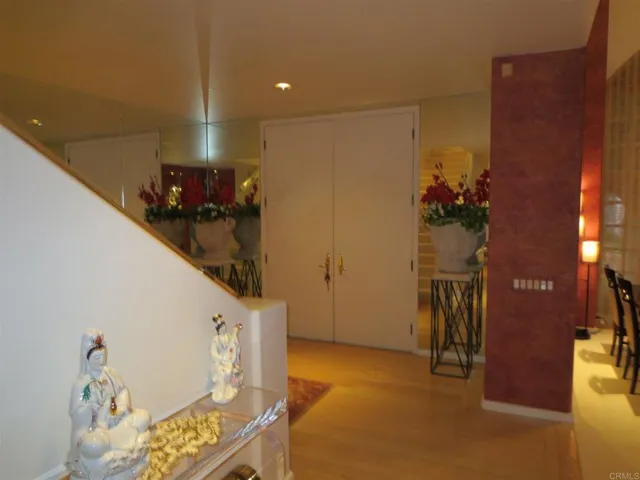 Double wide entry doors open to the dramatic living room.  High quality wood flooring throughout.
