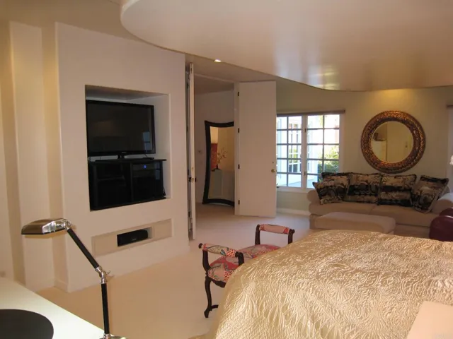 Notice the double wide 9' entry doors to the bedroom and the custom built-in features
