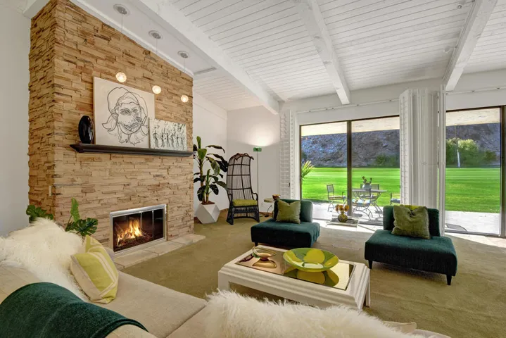 LIVING ROOM TO FAIRWAY ACROSS FIREPLACE