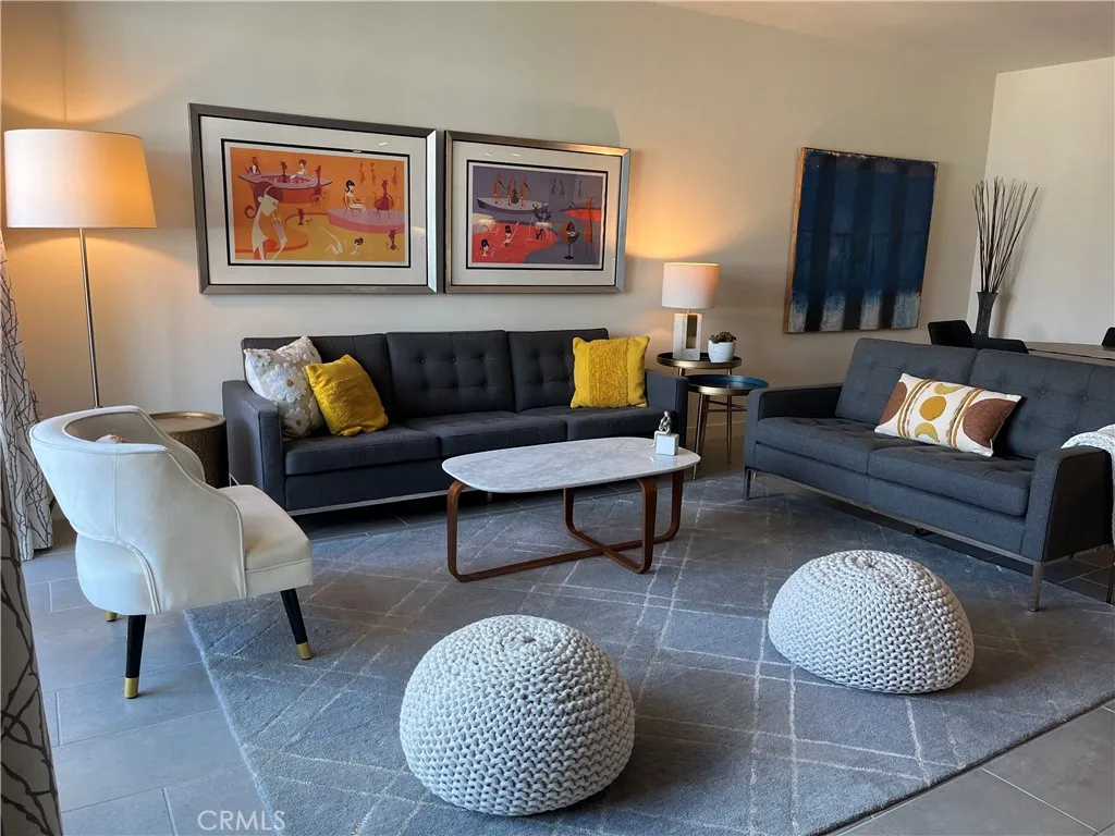 Living room off of kitchen. (This is most updated photo of furnishing in living room)