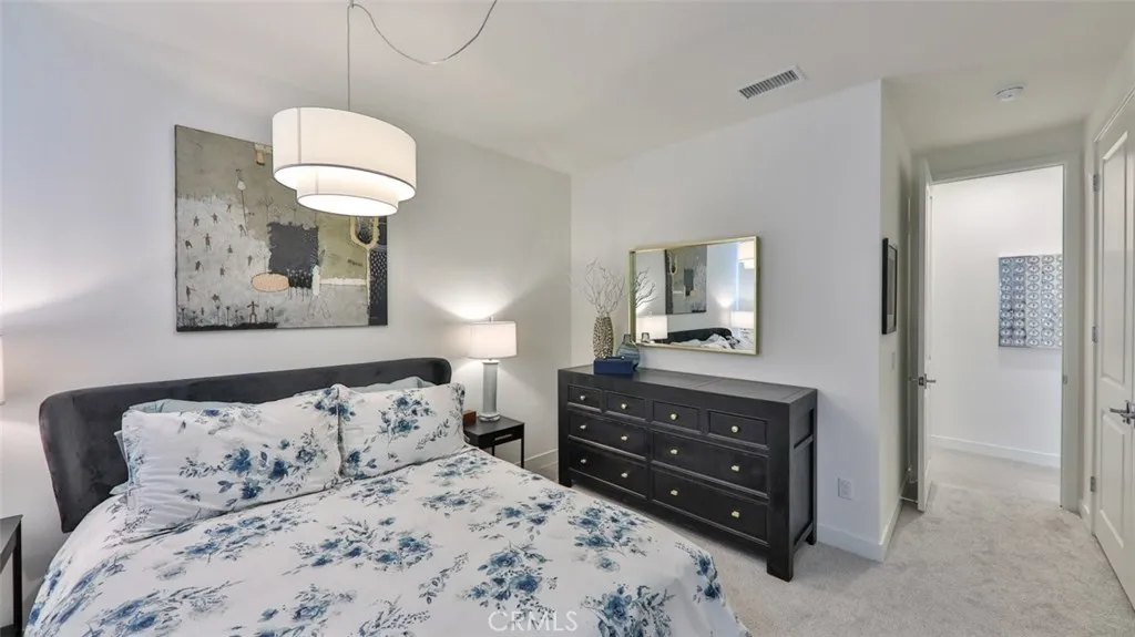 Secondary bedroom with queen bed.