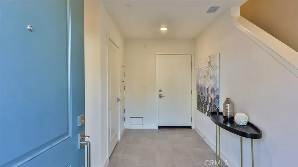 Welcome home. Entry foyer at front door / garage entrance / dumb waiter.