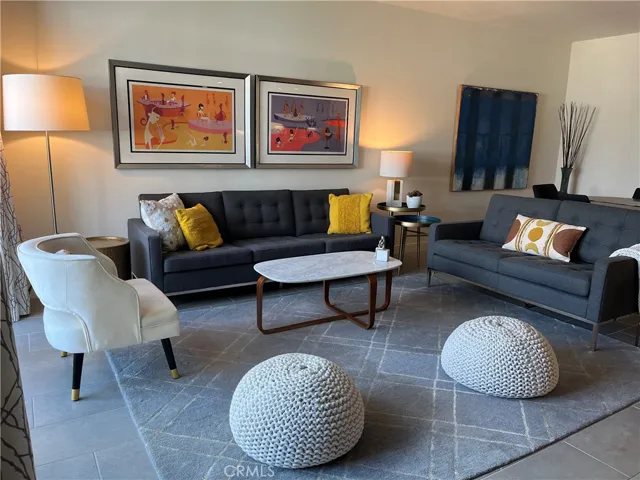 Living room off of kitchen. (This is most updated photo of furnishing in living room)