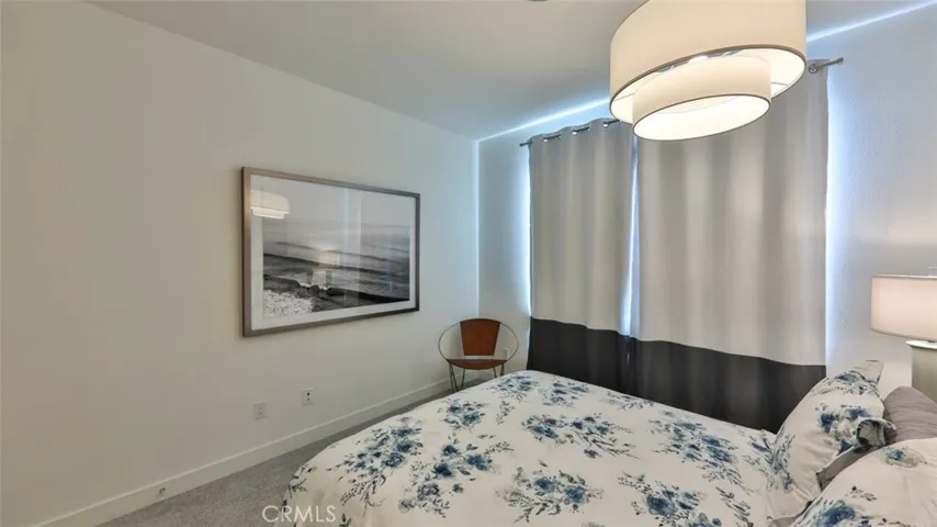 Secondary bedroom with queen bed.