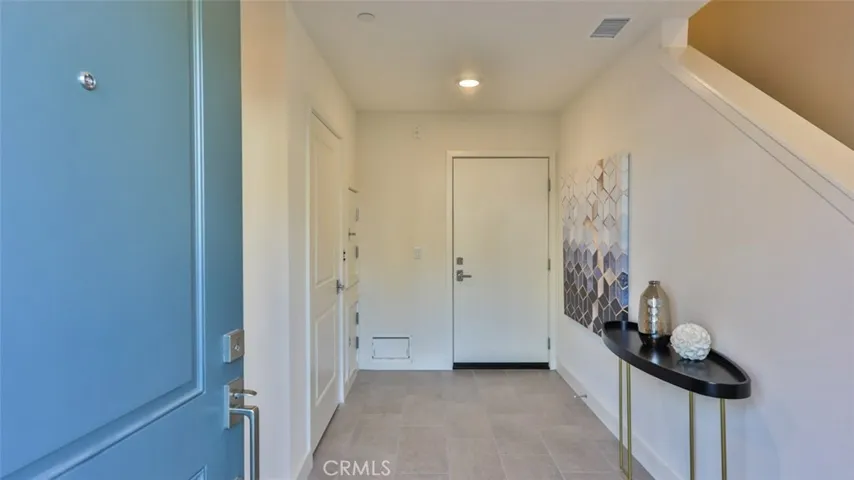Welcome home. Entry foyer at front door / garage entrance / dumb waiter.