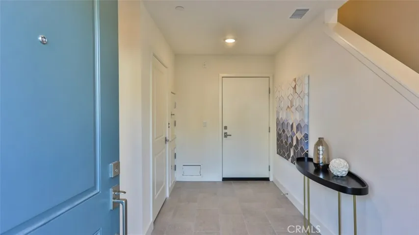 Welcome home. Entry foyer at front door / garage entrance / dumb waiter.
