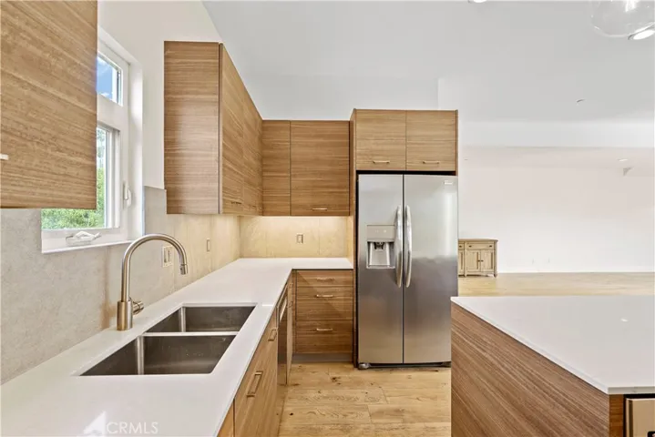 Quartz counters and custom veneer cabinets from Germany