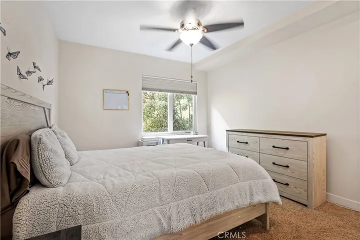 2nd bedroom with nice light and ceiling fan