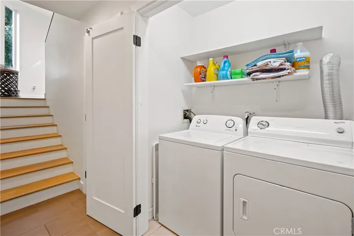 Laundry area and closet under the stairs