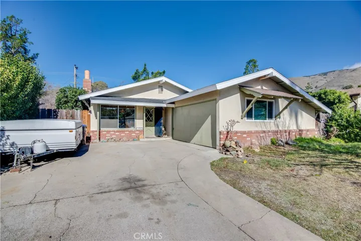 Street view of the home. Plenty of parking in the driveway for a trailer and also off street parking is available.