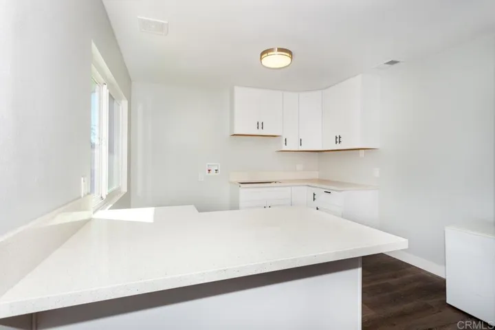 Bar area with full laundry hook ups could be a second kitchen??