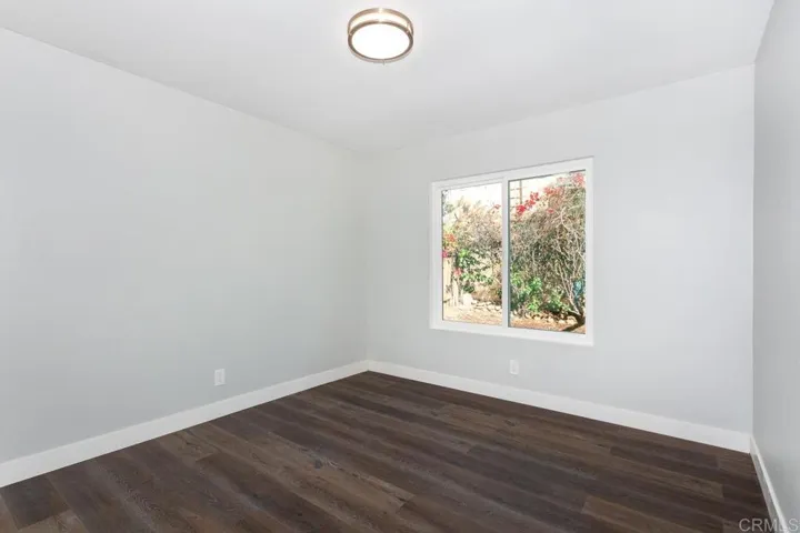 Rear bedroom.  Rent this back area out and pay about half your mortgage with the cash