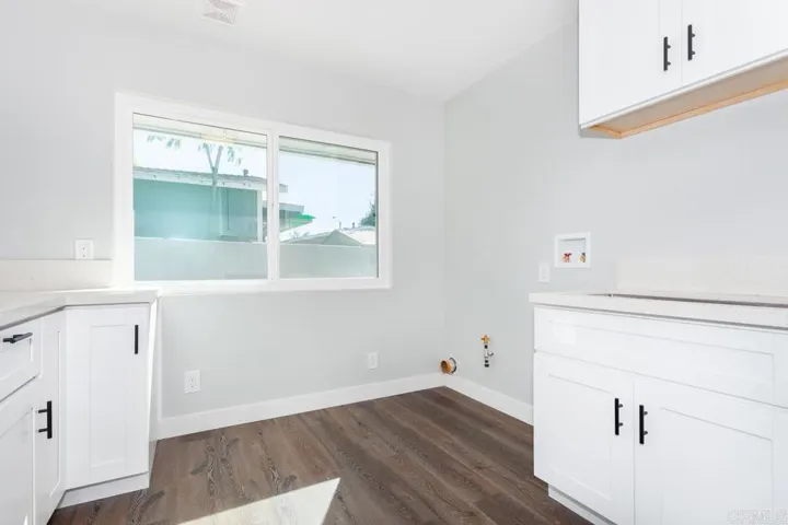 Bar/utility/kitchen in back part of house.  Rent this out or stick the Mother-in Law back there :)
