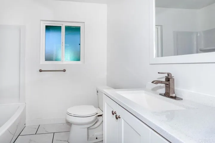 Rear bathroom off the Den.  Has an adjacent bedroom.