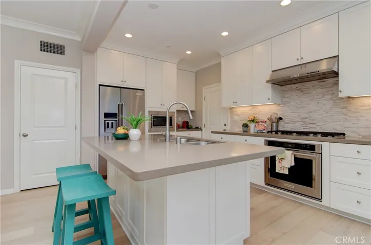 Sleek and classy kitchen with a huge island.