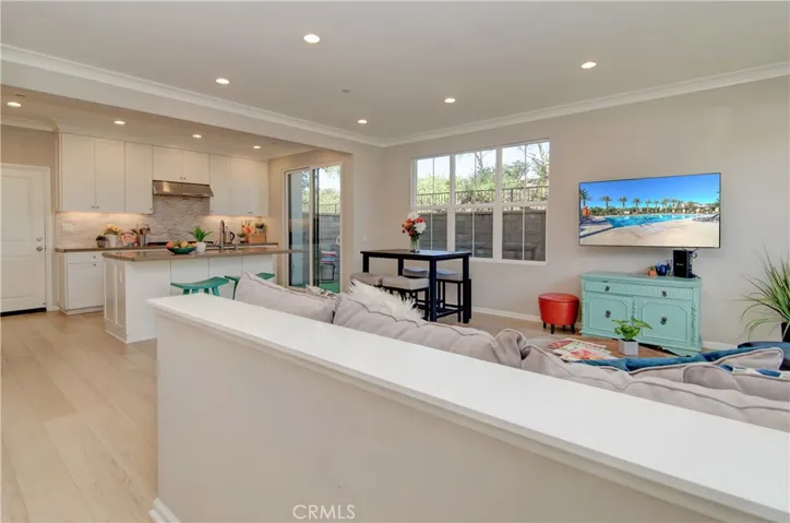 Hardwood flooring throughout the living area.  Crown molding and recessed lights add even more sophistication.
