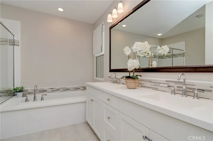 Dual vanities, shower and separate bathtub for the win.