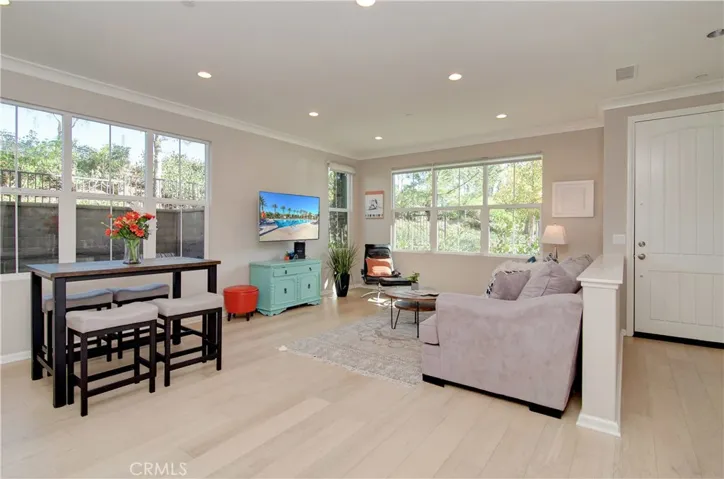 Extra natural light with oversized windows...being a corner unit adds even more light to this beautiful living room!