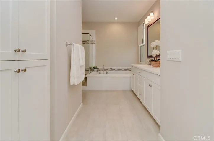 Relax in this tranquil master bathroom.