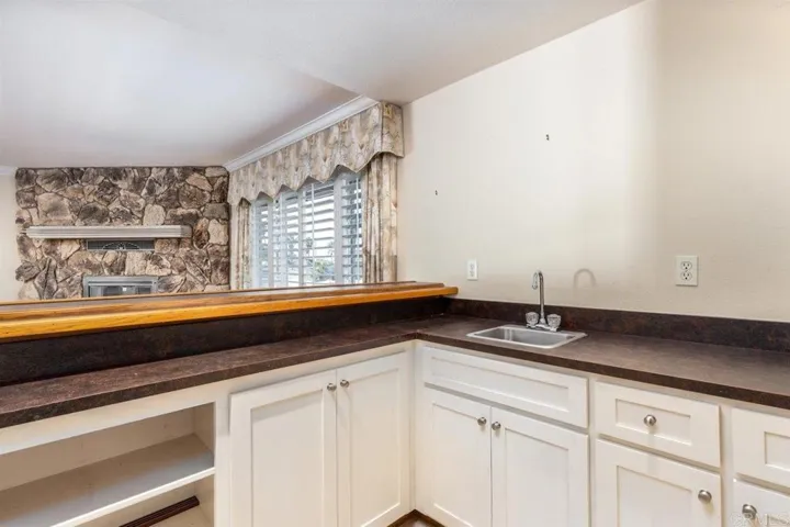 Wet bar off of entry & open to family room.