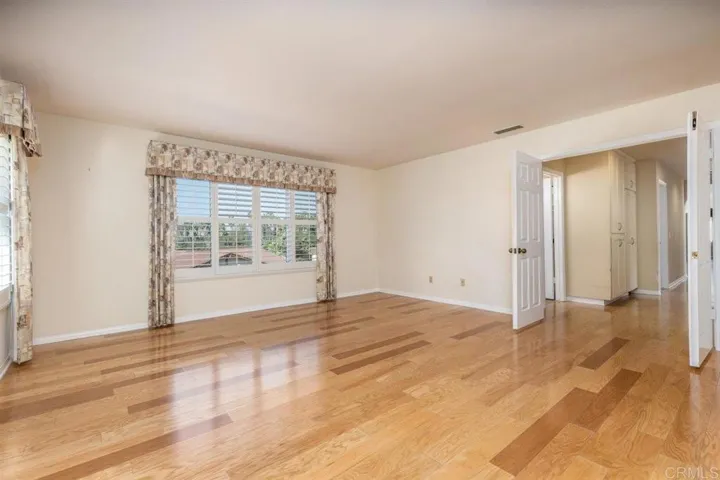 Another view of master bedroom w/double doors to hallway.