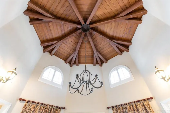 Dramatic, open beamed ceiling in entry tower.