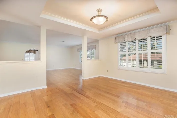 Formal dining room, looking into living room & entry.