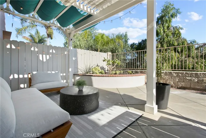 Sturdy patio cover has sliding panels to suit sun and shade enthusiasts.