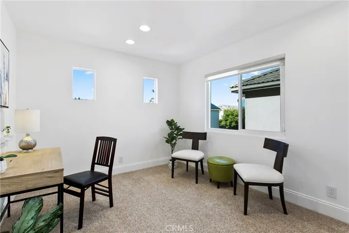 Bedroom #3 boasts windows on the west and north sides! check out those custom baseboards [yep, they are throughout the home].