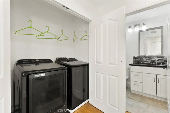 Extra deep Laundry Center is ready for your customized storage design. [Near New electric Samsung washer/dryer suite IS INCLUDED!]