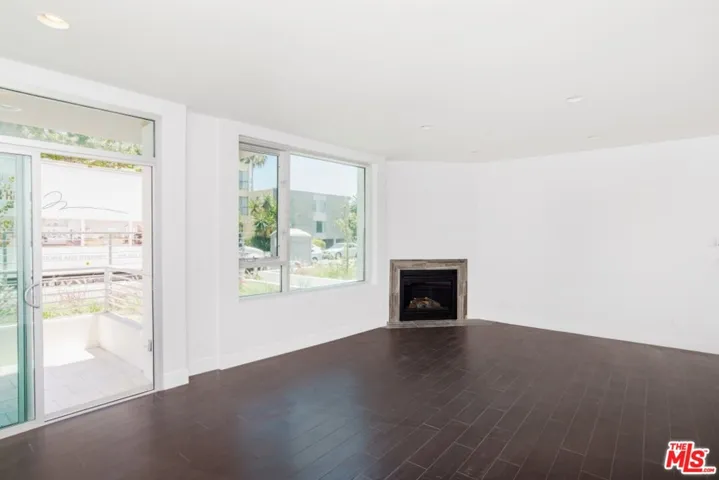 Living area wi gas fireplace and patio