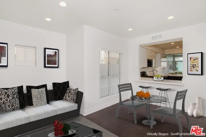 Virtually staged den/office area open to kitchen
